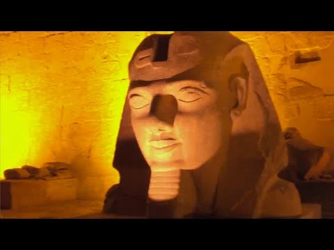 Video thumbnail showing a pharaoh statue illuminated in gold
